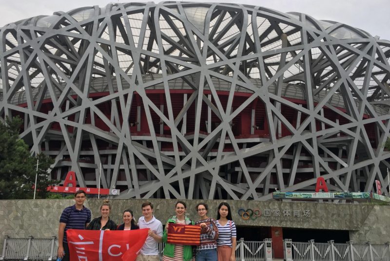 澳门六合彩平台网站投注 students stand in front of the Olympic Stadium in Beijing, China