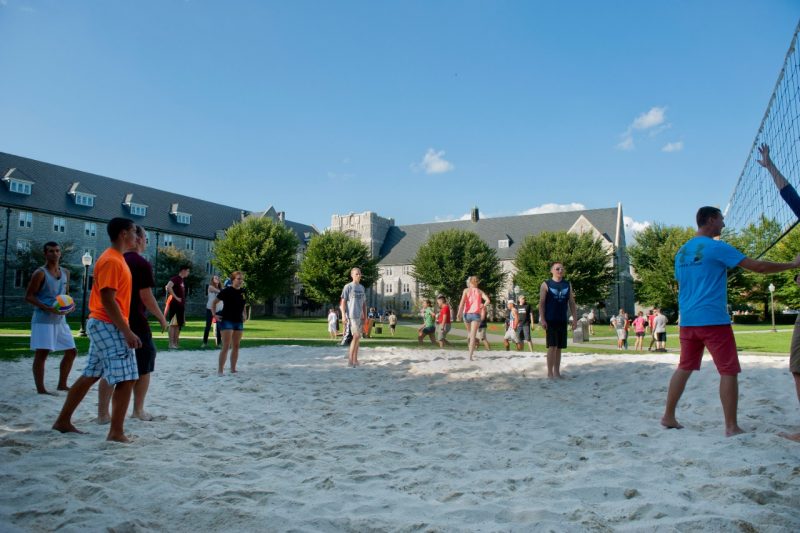 Students play volleyball in the Eggleston Quad